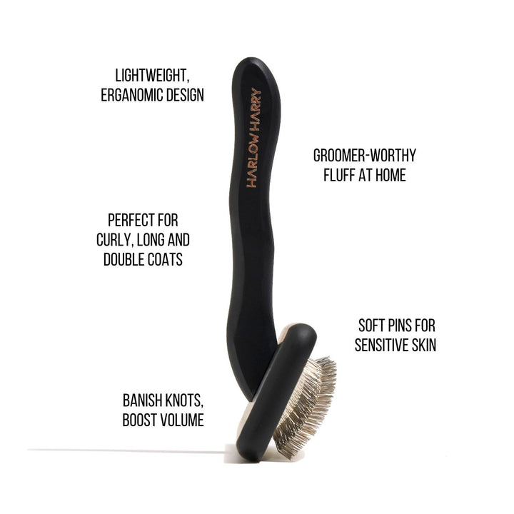 Black grooming brush with text highlighting features on a white background