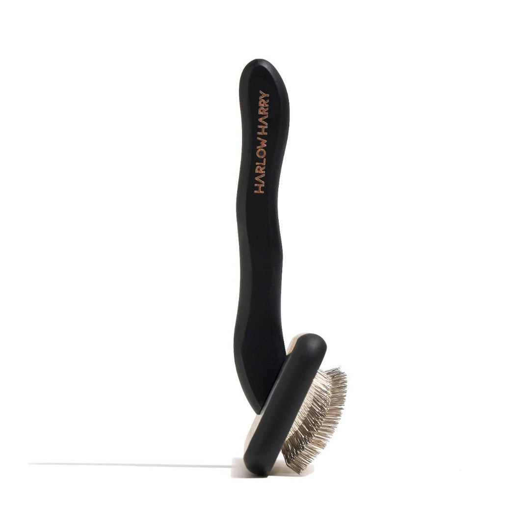 Professional slicker brush for dog grooming, perfect for all coat types.